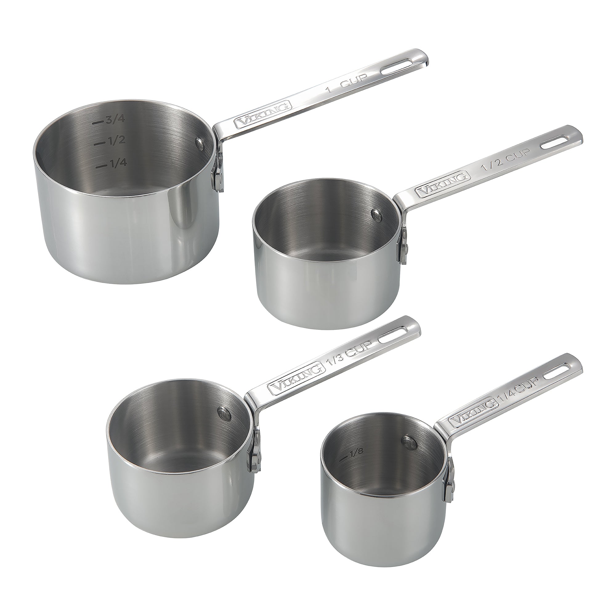 Four stainless steel measuring cups of different sizes (1 cup, 1/2 cup, 1/3 cup, and 1/4 cup) are arranged on a white background. Each cup has measurement markings and a long handle.