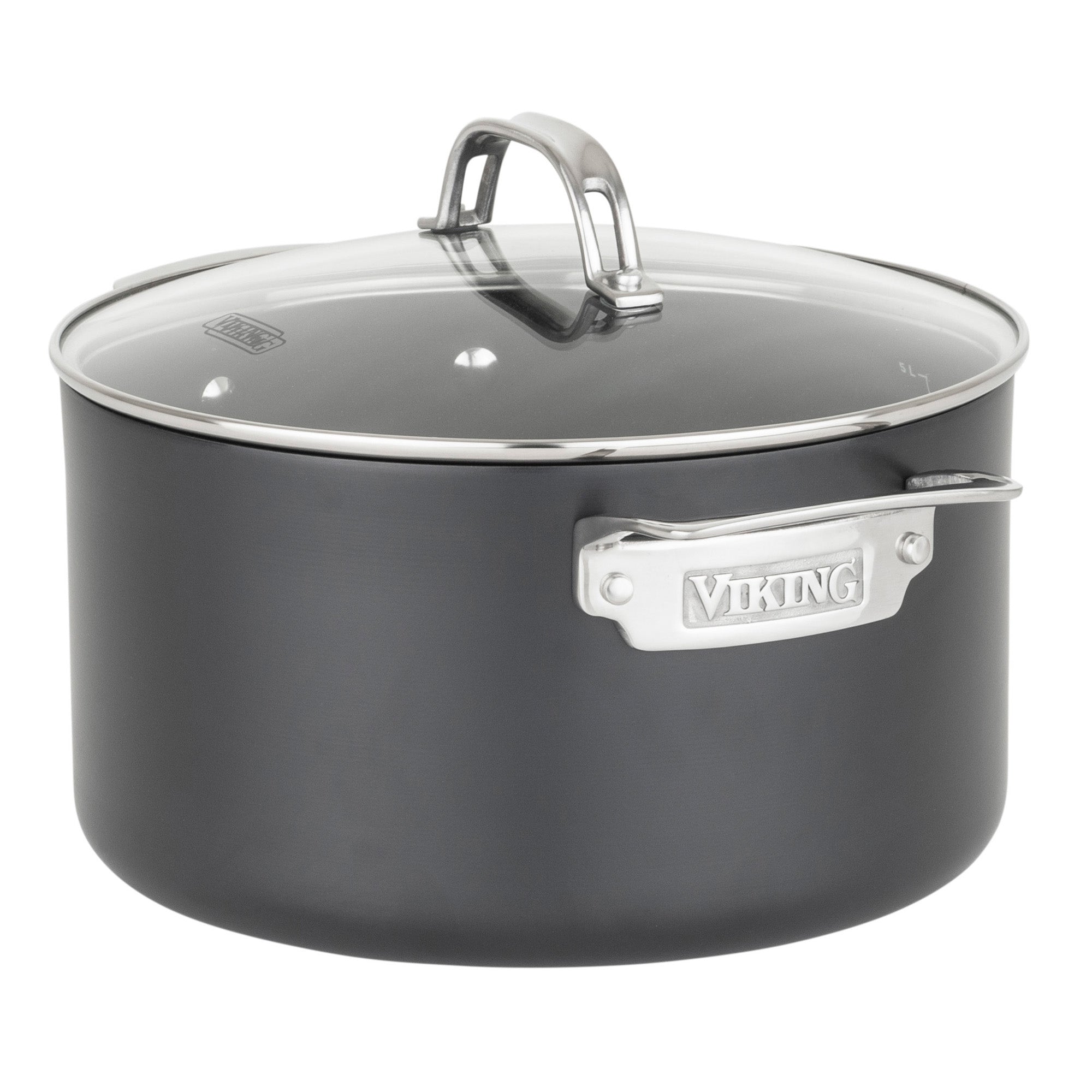 A black, round pot from the Viking Hard Anodized Ceramic Nonstick 12pc Cookware Set by Viking Culinary Products features a clear glass lid, metal handles with the brand embossed on a plate, and is PFAS free.