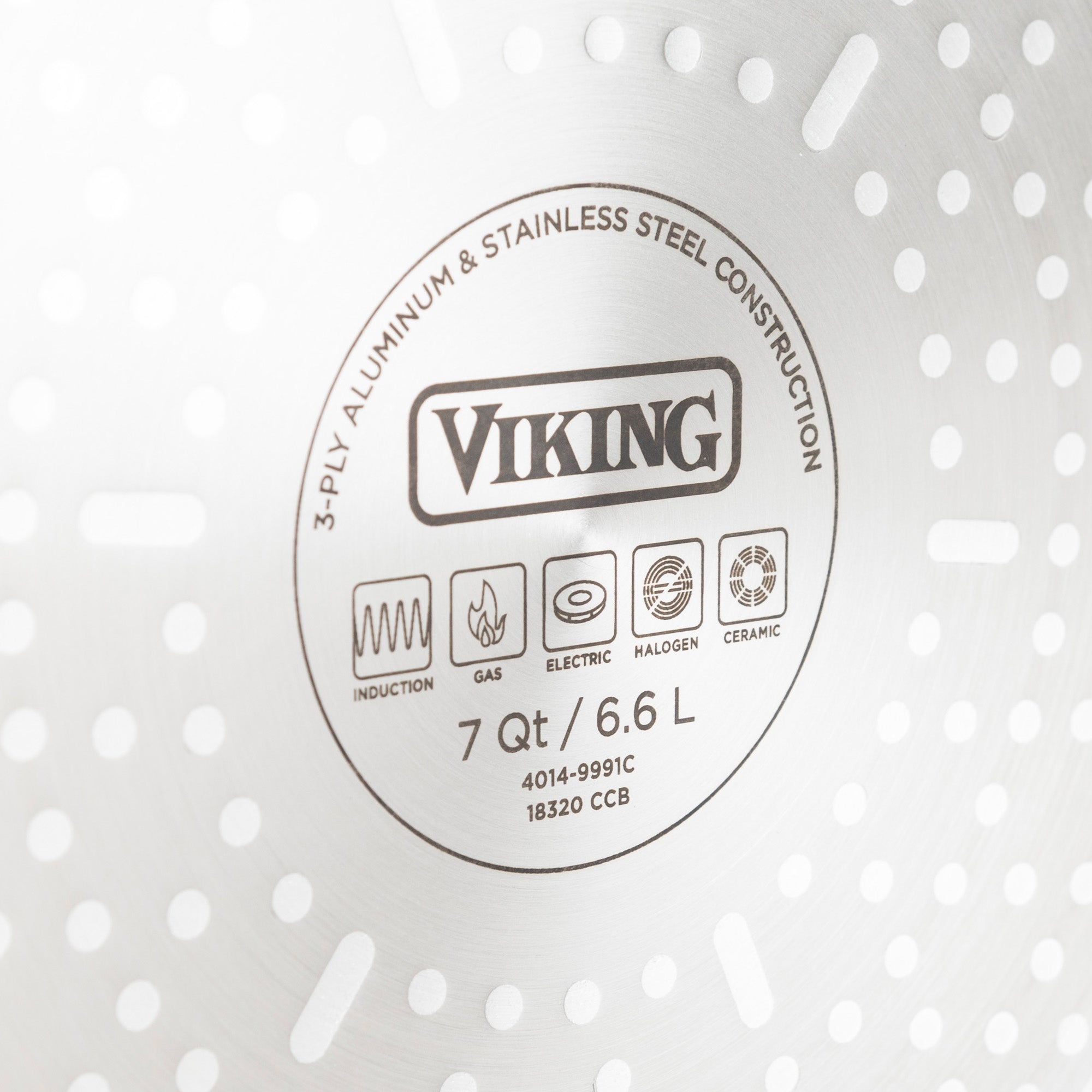 Close-up of the bottom of a Viking stainless steel cookware piece, showing the brand name, size (7 Qt/6.6 L), and compatibility icons for induction, gas, electric, halogen, and ceramic stovetops.
