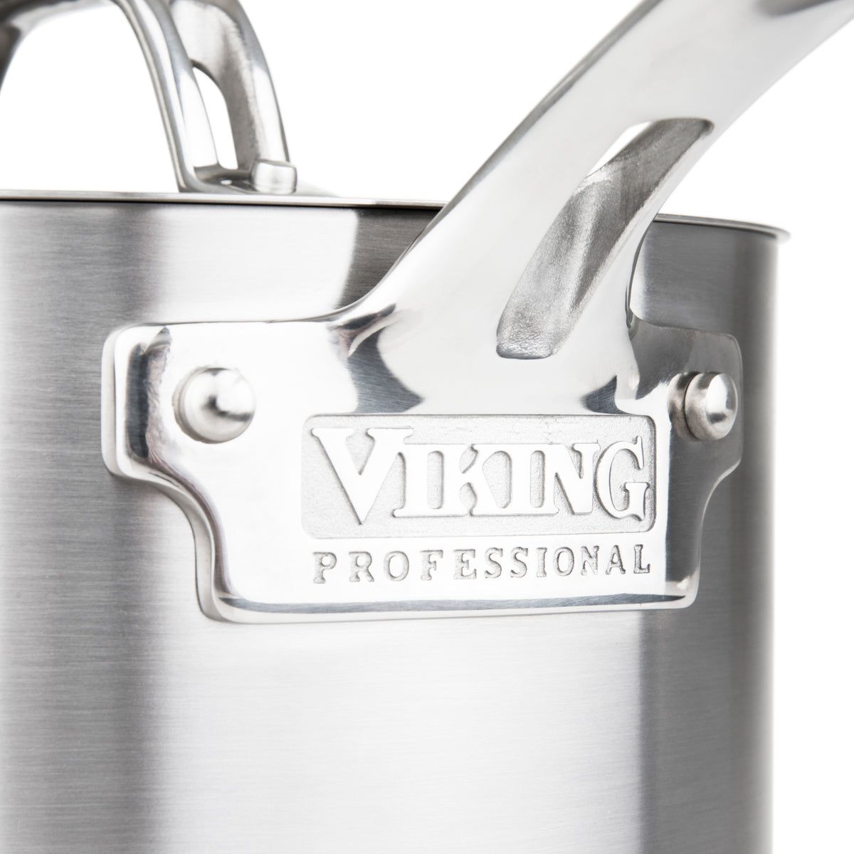 Close-up of a stainless steel pot or pan with a handle, featuring an engraved metal label that reads Viking Professional.