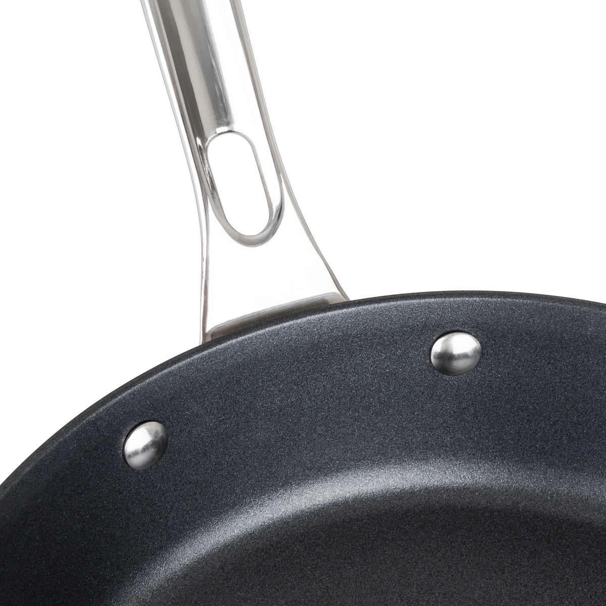Close-up of the Viking Contemporary 3-Ply Stainless Steel 10-Inch Nonstick Fry Pan by Viking Culinary Products, featuring a black nonstick interior, shiny silver rivets, and a stainless steel handle with an oblong hole near its base.