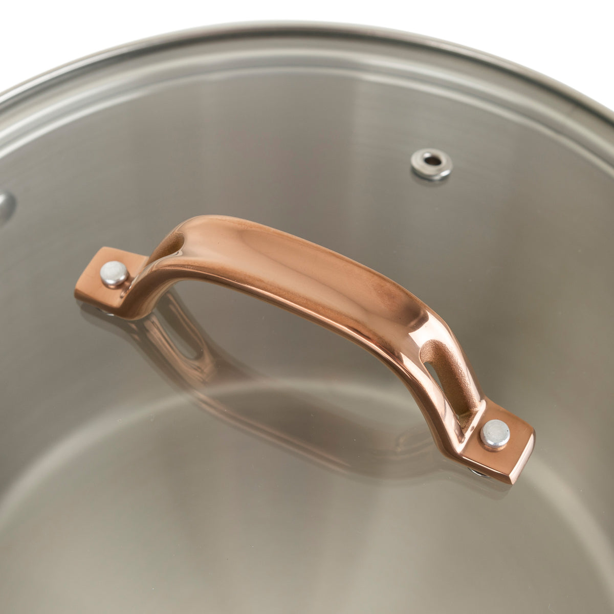 Close-up of a clear vented glass lid with a metallic bronze, stay-cool handle on Viking Culinary Products’ 3-Ply 11 Piece Black and Copper Cookware Set with Glass Lids.
