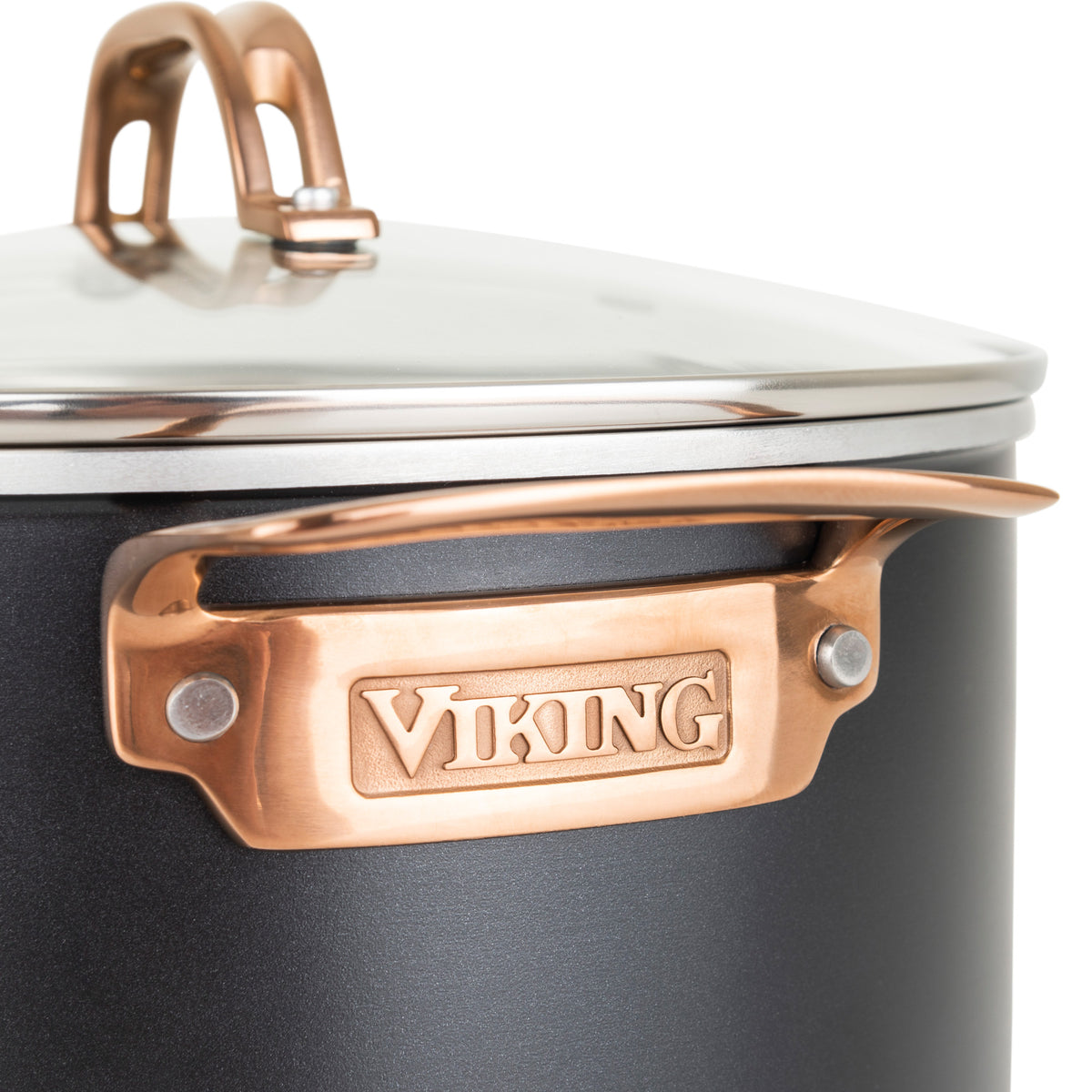 Close-up of a Viking 3-Ply 11 Piece Black and Copper Cookware Set with glass lids by Viking Culinary Products, featuring a black pot with copper stay-cool handles embossed with the Viking name, matching lid handle, and stylish premium design.