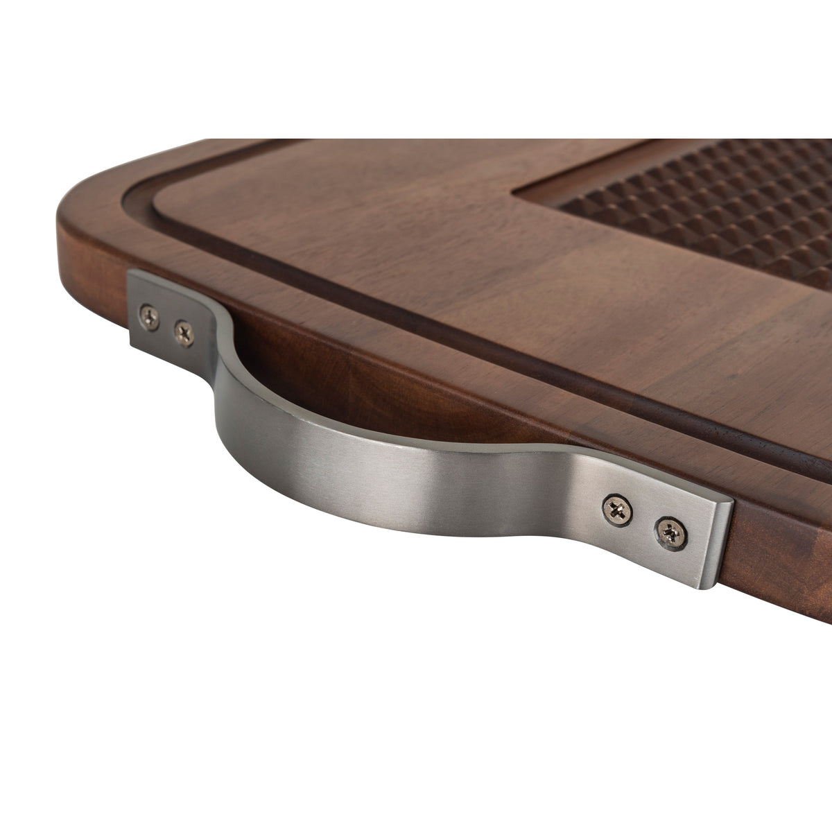 Close-up of the Viking Acacia Carving Board by Viking Culinary Products, featuring heavy-duty metal handles attached by screws, a grooved juice well along the edge, and a textured surface section.
