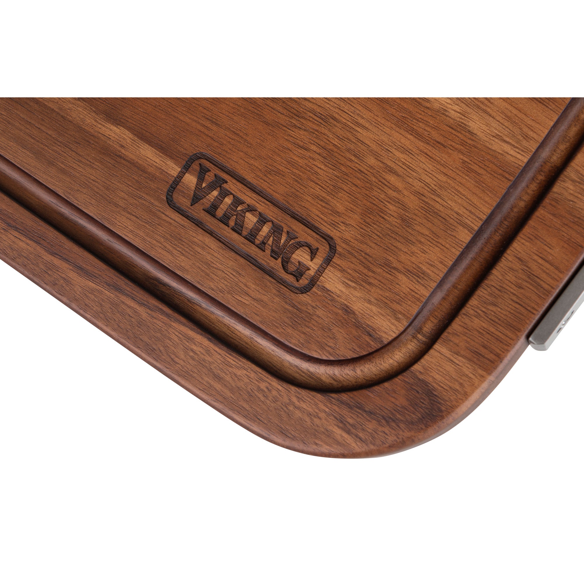A close-up of the Viking Acacia Carving Board with Juice Well and Metal Handle from Viking Culinary Products, showing its dark juice well near the edge and engraved VIKING logo.