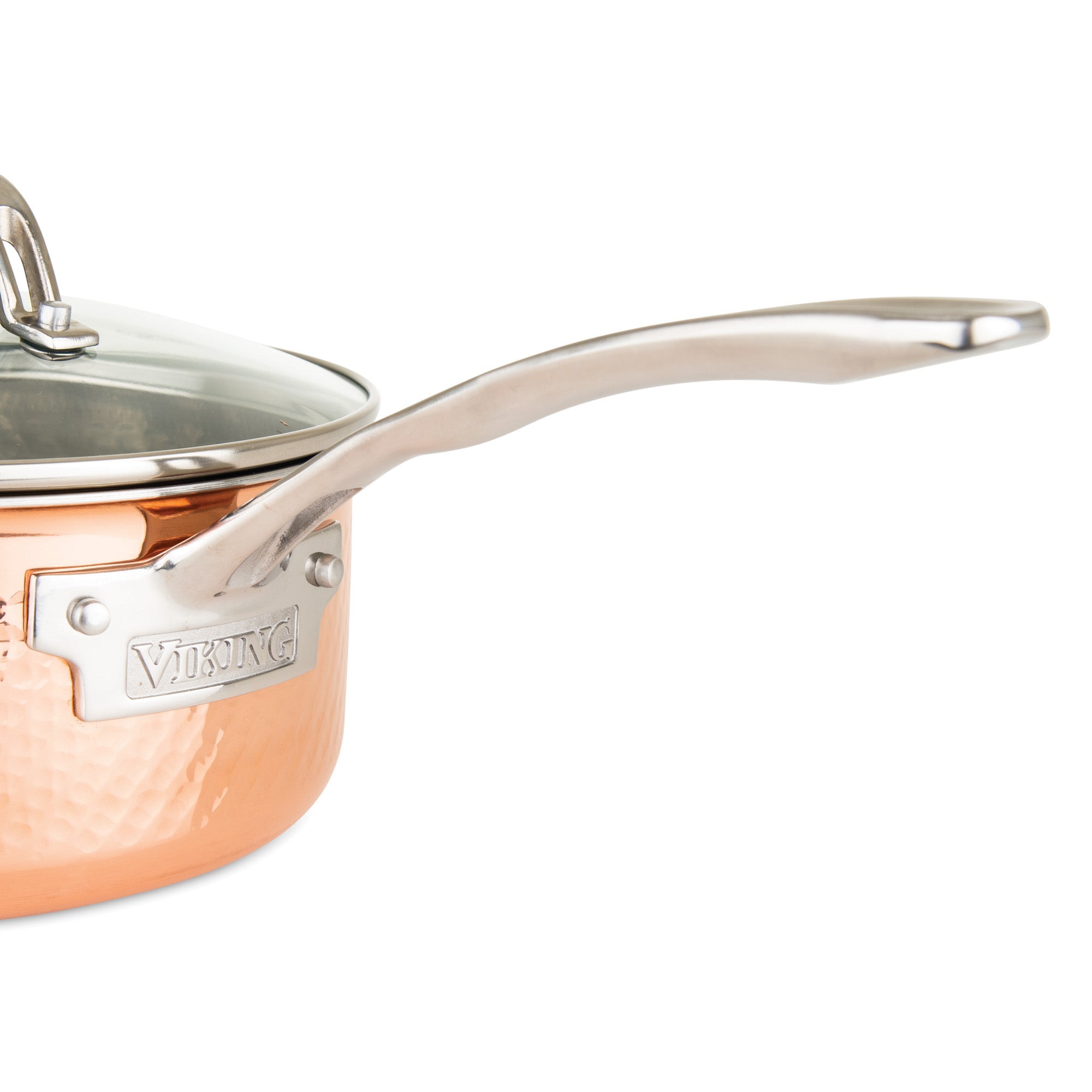 A close-up of a Viking Culinary Products 3-Ply Hammered Copper Clad saucepan with a durable copper exterior, ergonomic stainless steel handle, and glass lid featuring the Viking brand plaque.