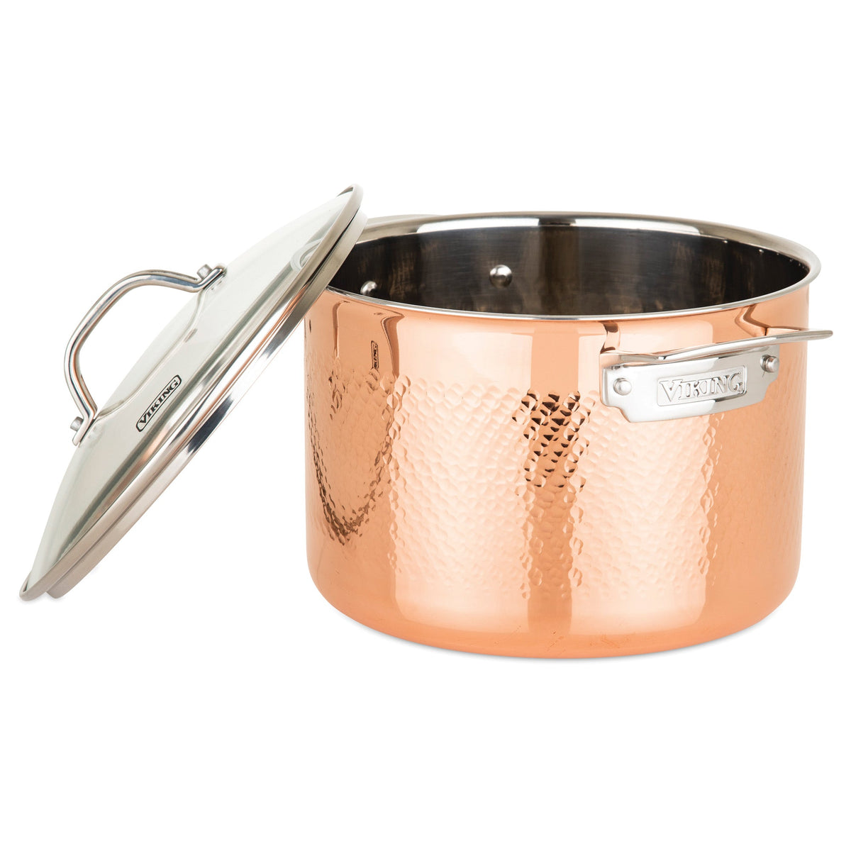 The Viking Culinary Products 3-Ply Hammered Copper Clad 10-Piece Cookware Set features sturdy metal handles, glass lids, a shiny hammered copper exterior, and a surgical-grade stainless steel interior with the VIKING label on the side.