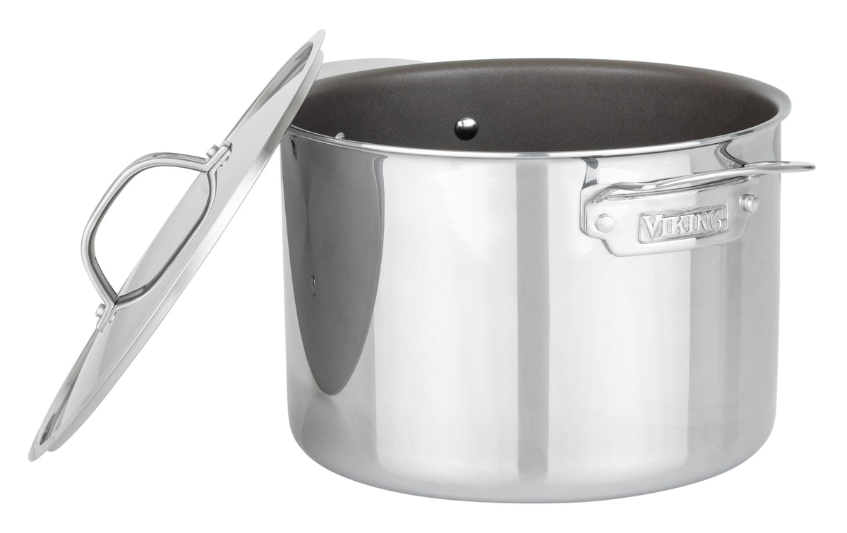 The Viking PureGlide Pro 3-Ply 8-Quart Stock Pot by Viking Culinary Products features a shiny stainless steel nonstick finish, two side handles, and a metal lid—perfect for those seeking chemical-free cookware.