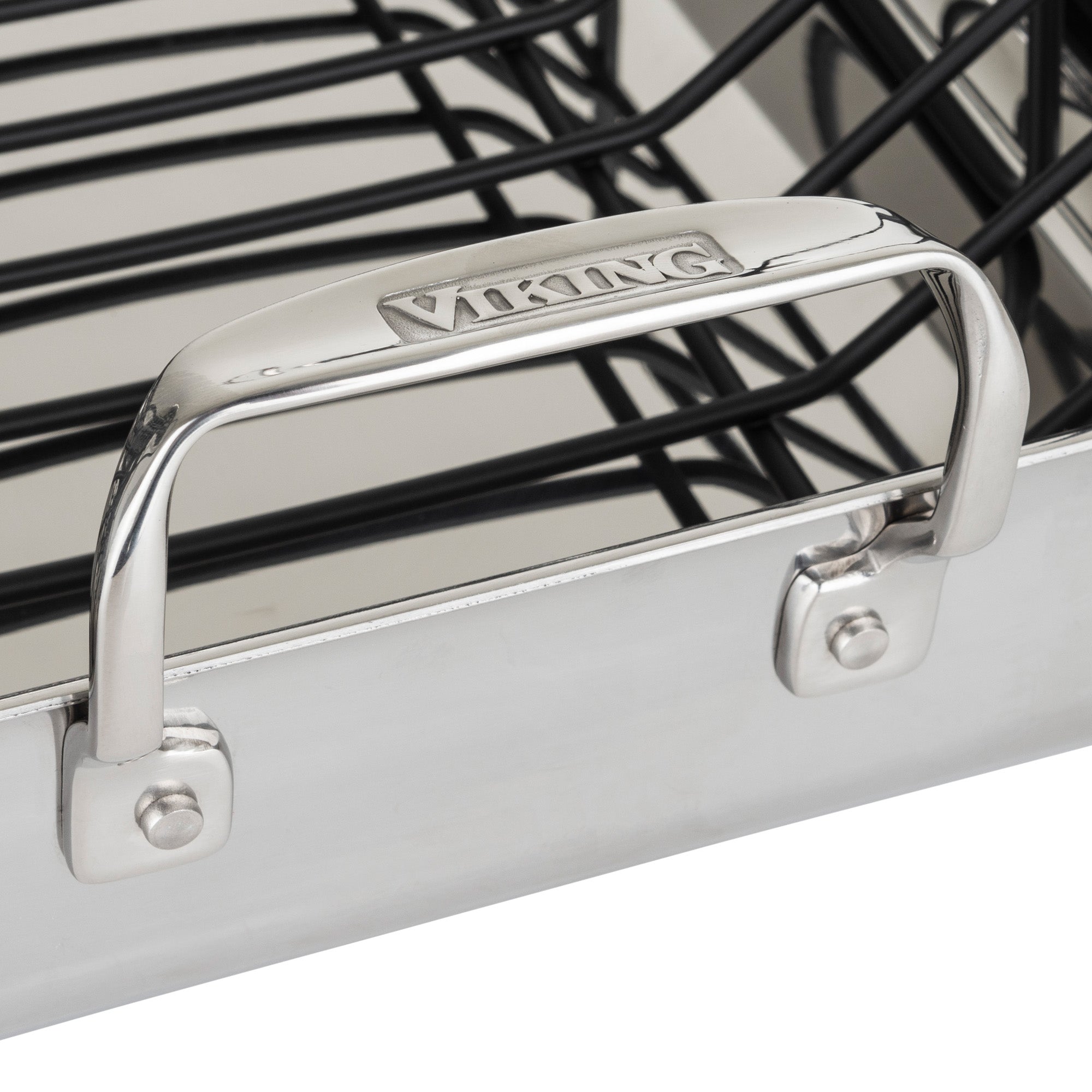 Close-up of the Viking Culinary Products 3-Ply Stainless Steel Roaster with metal handles, a removable nonstick rack inside, and includes a bonus digital thermometer.