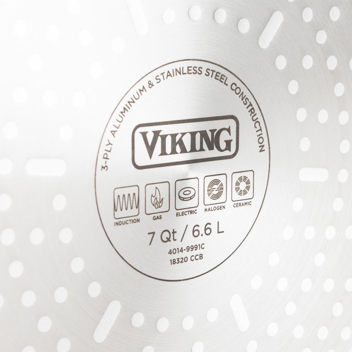 Close-up of the bottom of a Viking stainless steel cookware piece, showing the brand name, size (7 Qt/6.6 L), and compatibility icons for induction, gas, electric, halogen, and ceramic stovetops.