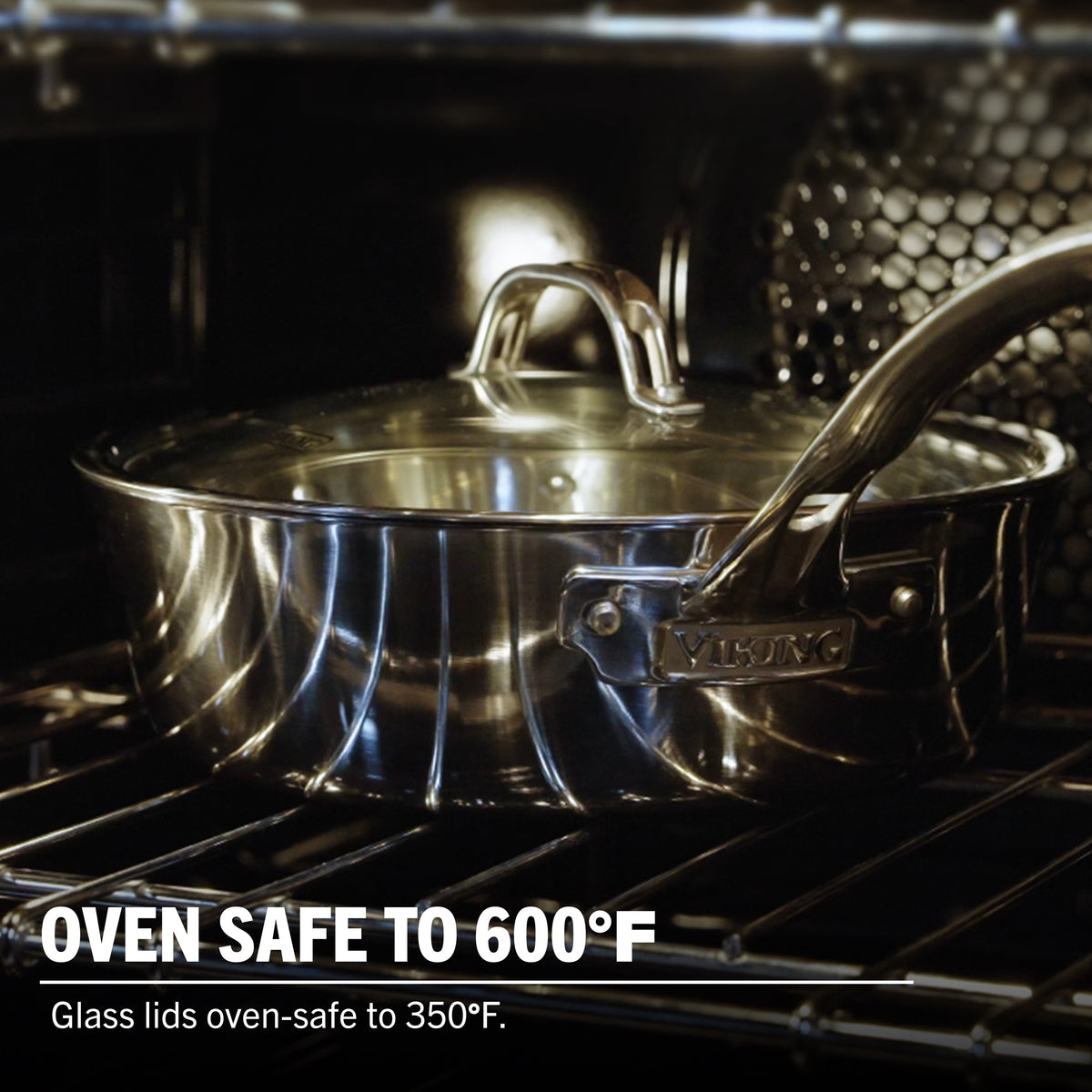 The Viking Contemporary 3-Ply 4.8-Quart Sauté Pan with Glass Lid by Viking Culinary Products sits on an oven rack. Oven safe up to 600°F (pan), glass lid safe to 350°F, and induction compatible for versatile cooking.