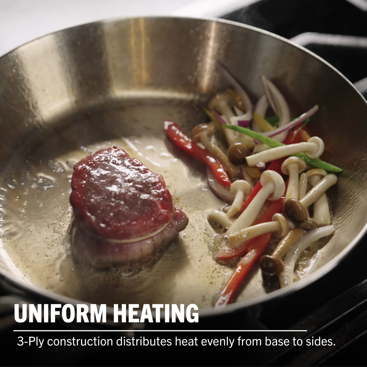 The Viking Contemporary 3-Ply Stainless Steel 12-Inch Fry Pan evenly sears meat and sautés veggies like mushrooms and peppers. Uniform heating from its 3-ply build, plus induction compatibility—quality from Viking Culinary Products.