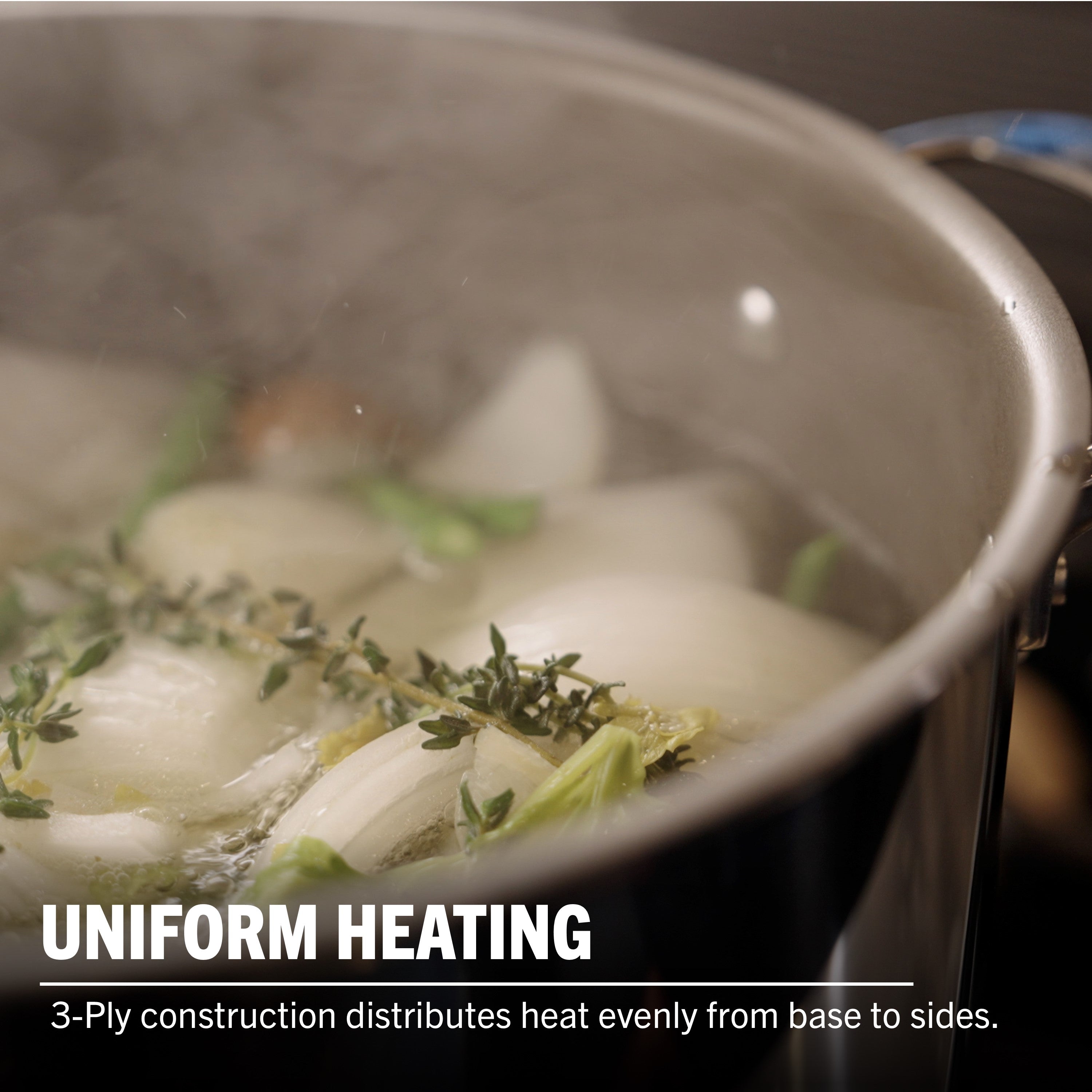 A close-up of the Viking PureGlide Pro 3-Ply 8-Quart Stock Pot by Viking Culinary Products, filled with onions, herbs, and veggies simmering. Steam rises. Text: UNIFORM HEATING. 3-ply design distributes heat evenly from base to sides.