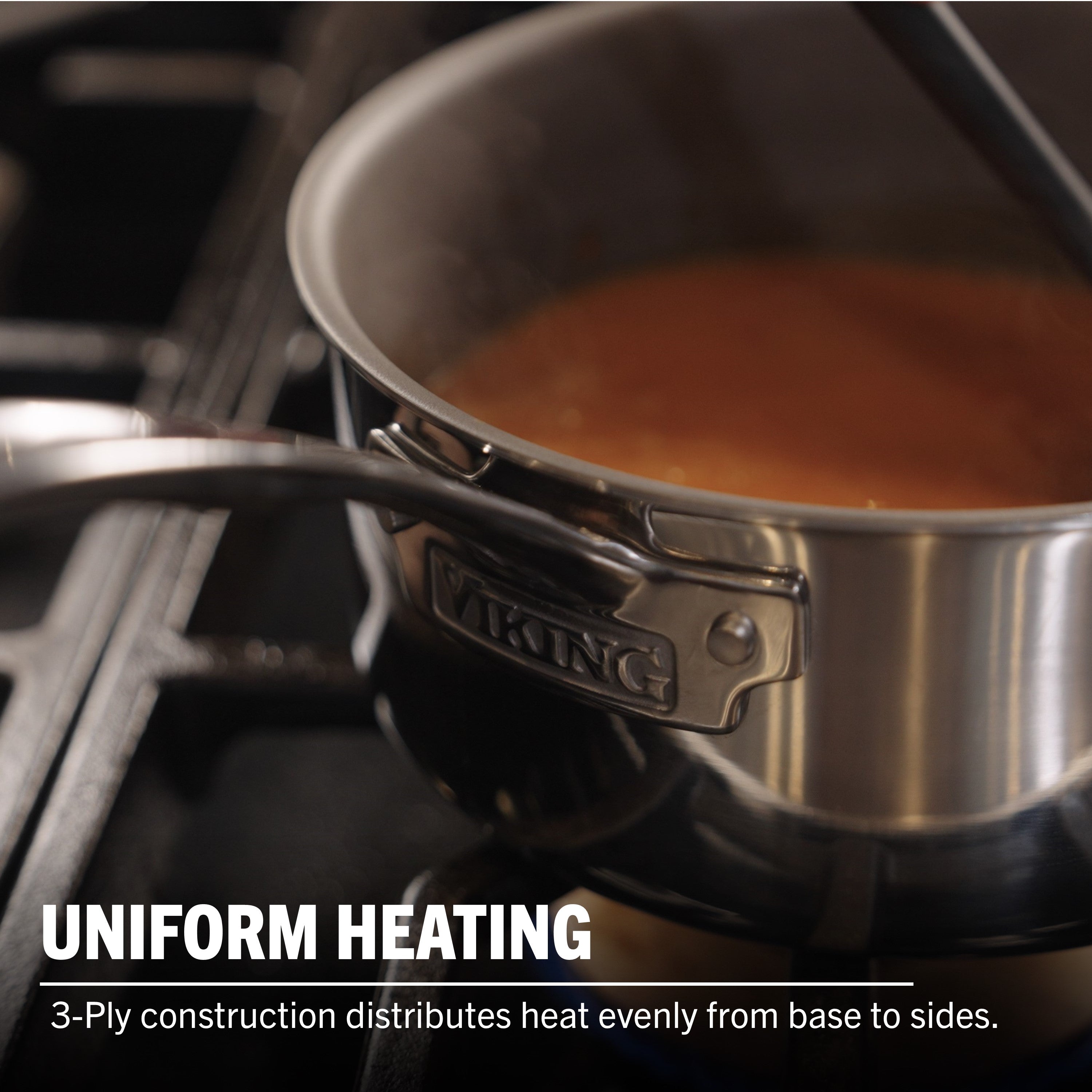 A Viking Culinary Products PureGlide Pro 3-Ply 3-Quart Sauce Pan with Metal Lid heats sauce on the stove. Text: “Uniform heating—3-ply construction ensures even heat distribution from base to sides.”.