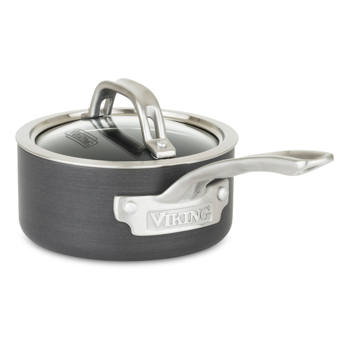 The Viking Hard Anodized Nonstick 1-Quart Sauce Pan by Viking Culinary Products features a dark gray finish, long stay-cool metal handle, clear glass lid, and a branded metal plate on the side.