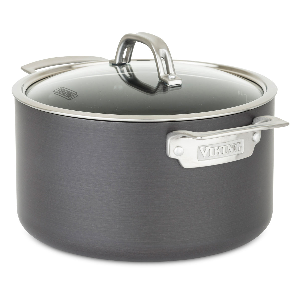 The Viking Hard Anodized Nonstick 6-Quart Dutch Oven by Viking Culinary Products features silver handles, a glass lid, and the brand name engraved on the side handle. Its crafted from hard anodized aluminum and shown on a plain white background.