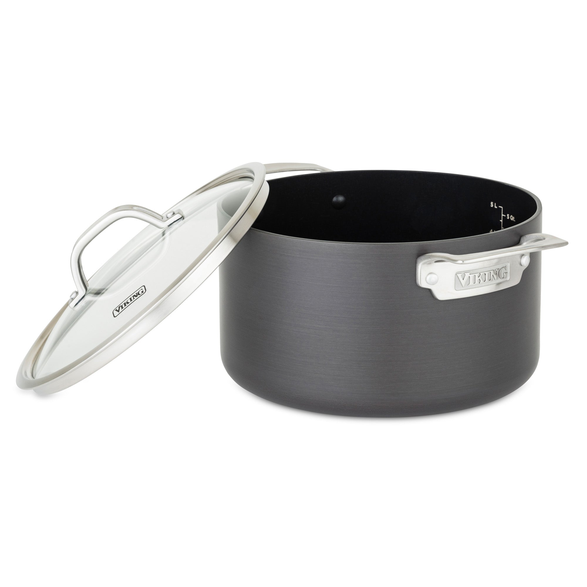 The Viking Hard Anodized Nonstick 6-Quart Dutch Oven by Viking Culinary Products is a large, dark gray pot with metal handles, interior measurement markings, a durable nonstick surface for easy cleanup, and comes with an angled glass lid.