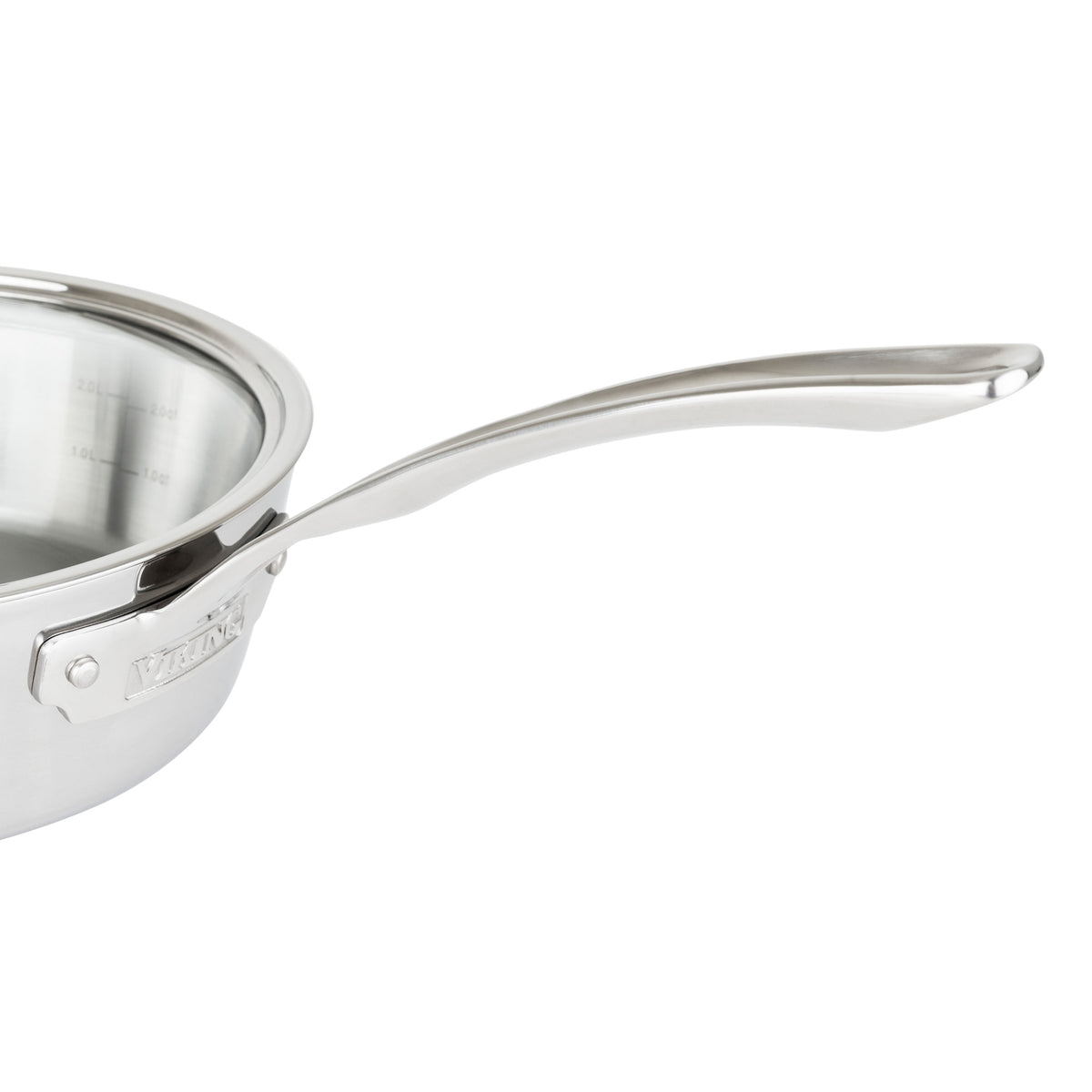 Close-up of the Viking Contemporary 3-Ply 3.6-Quart Sauté Pan by Viking Culinary Products, showing its shiny stainless steel finish, long curved handle, visible rim, and measurement markings. Induction compatible design and includes a glass lid.