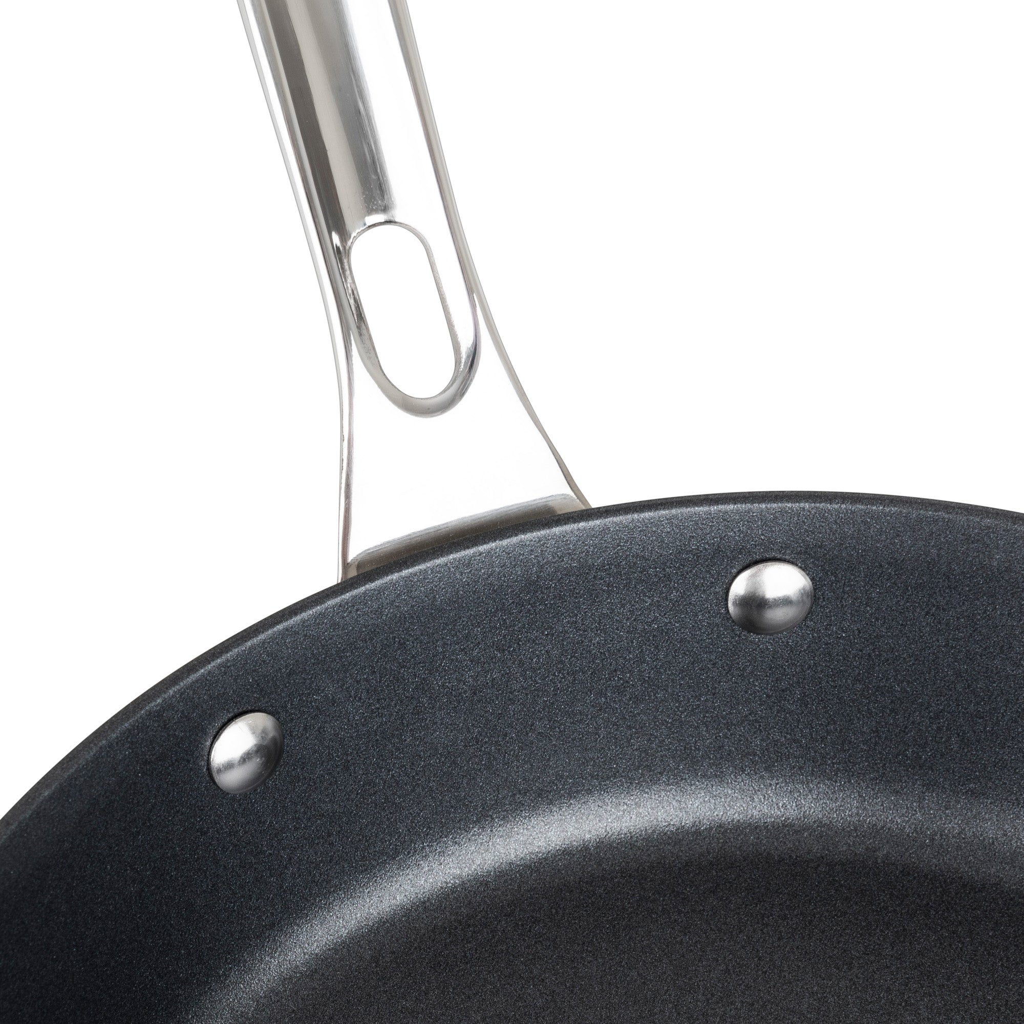 Close-up of the Viking Contemporary 3-Ply Stainless Steel 10-Inch Nonstick Fry Pan by Viking Culinary Products, featuring a black nonstick interior, shiny silver rivets, and a stainless steel handle with an oblong hole near its base.