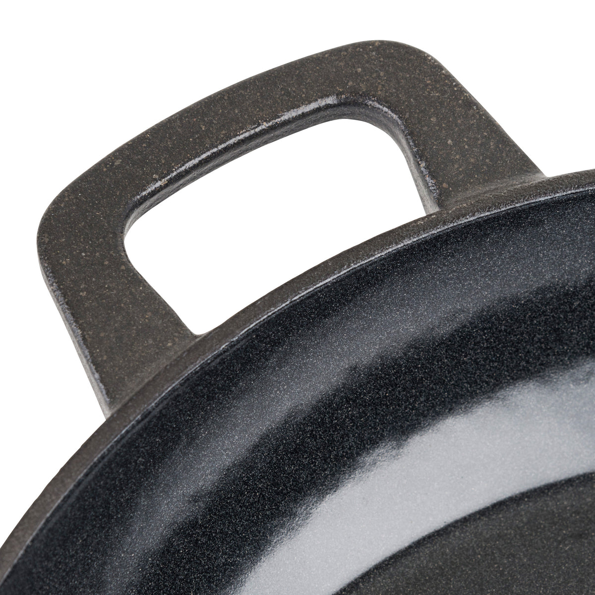 Close-up of the Viking Enameled Cast Iron 10.5-Inch Chefs Pan by Viking Culinary Products, featuring its handle and rim against a white background—perfect for versatile cooking needs.
