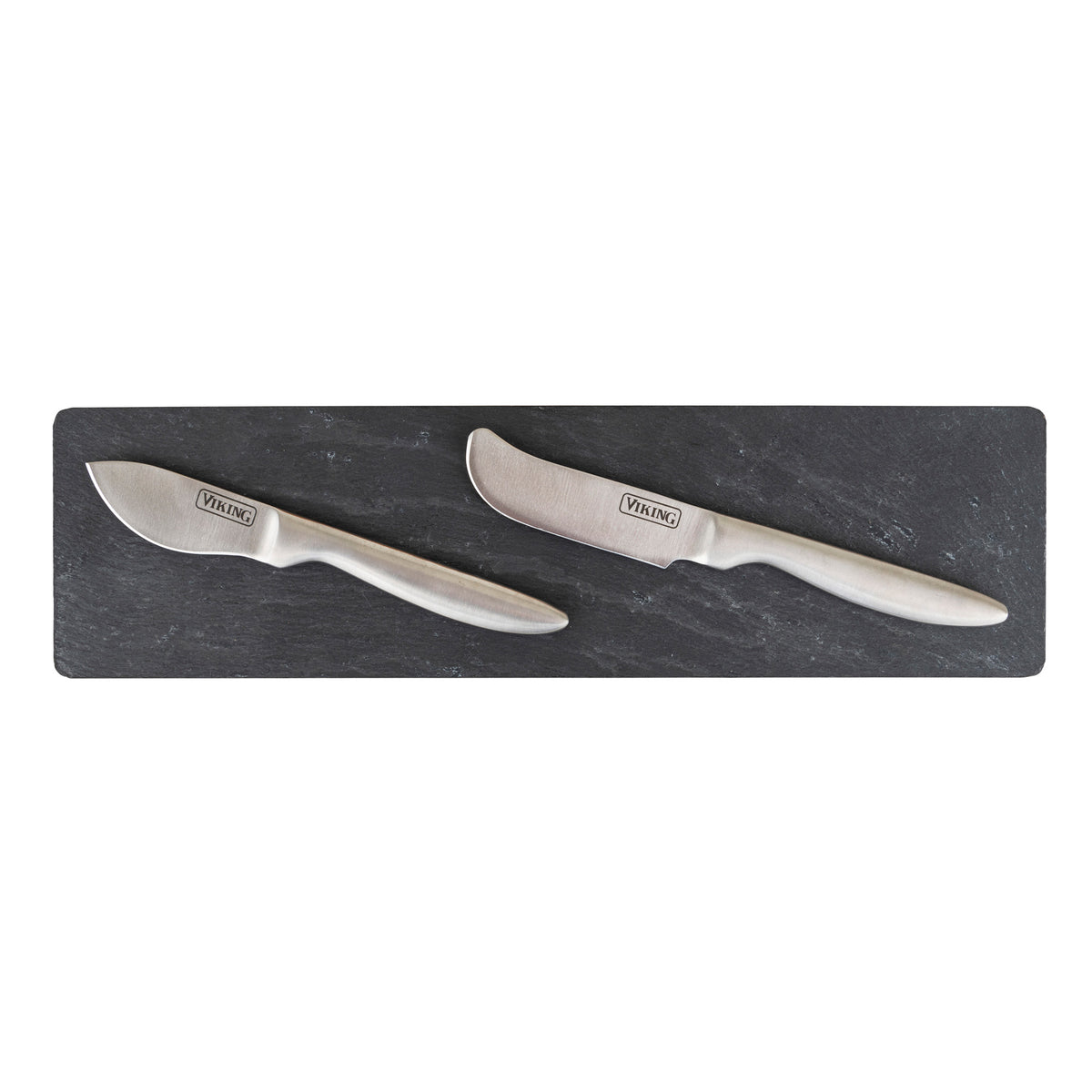 The Viking 7-Piece Acacia Wood Slate Cheese Board Set by Viking Culinary Products features two stainless steel cheese knives with Viking logos on a rectangular acacia wood board with a sleek slate insert, both knives displayed diagonally, handles to the left.