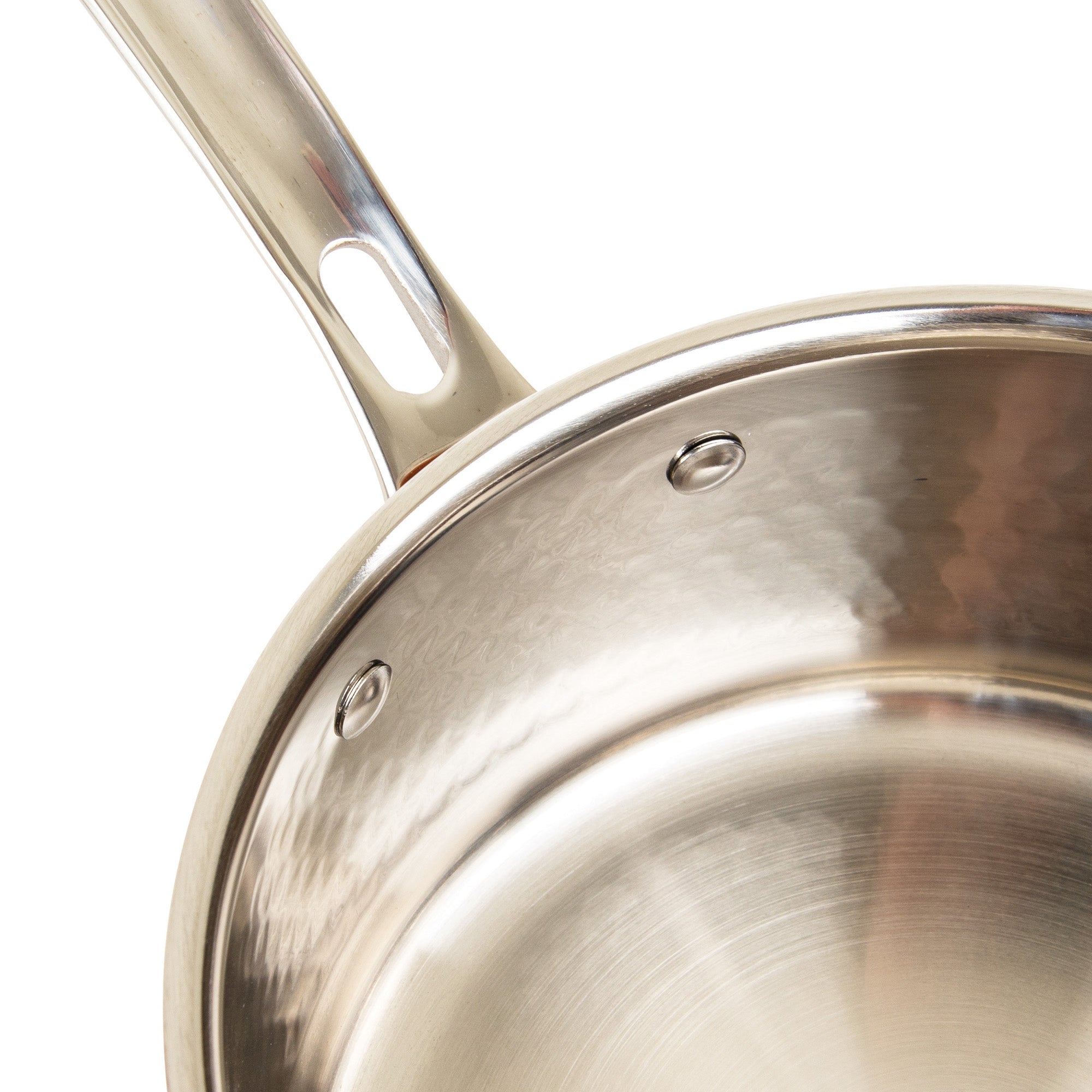 Close-up of a Viking Culinary Products 3-Ply Hammered Copper Clad saucepan from the 10-piece set, featuring a brushed stainless interior, riveted ergonomic handle, and a durable, reflective finish with part of its glass lid visible.